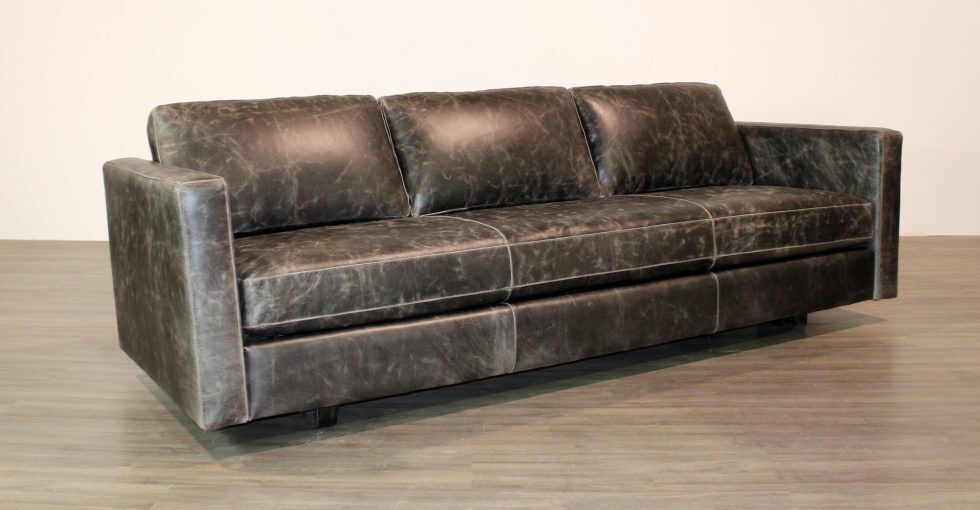 leather sofa with a wood spine