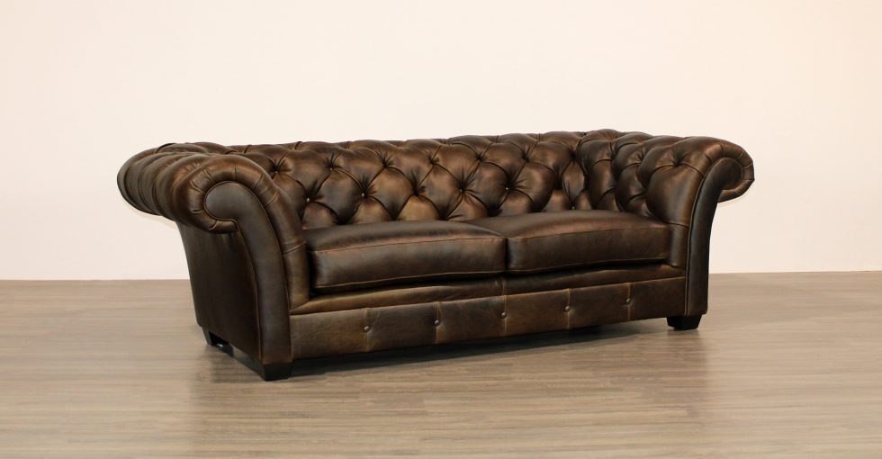 tufted sofa with flared arms